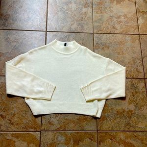 Divided cream colored sweater